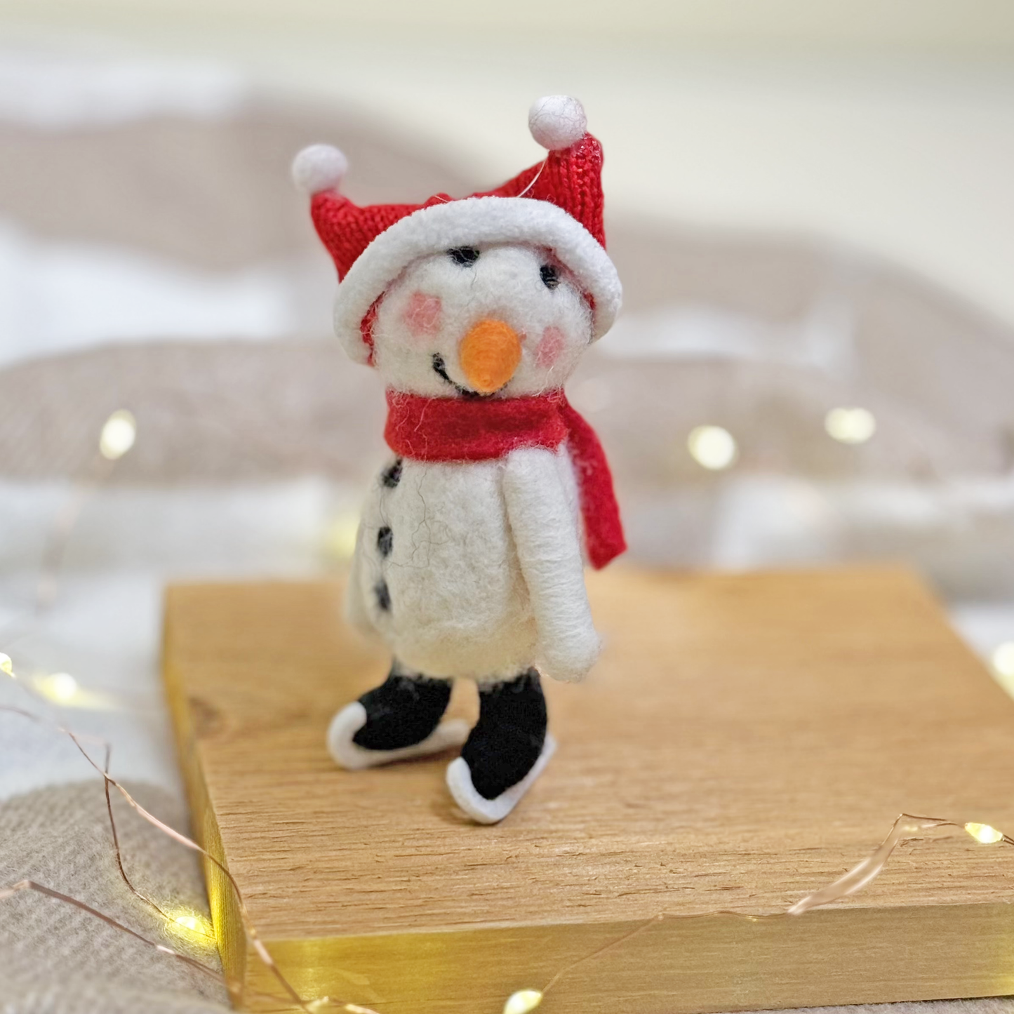Felted Skating Snowman Ornament.